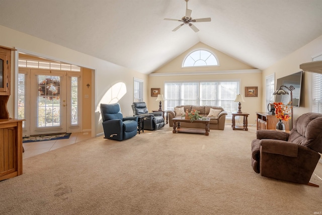 living room with light colored carpet, high vaulted ceiling, and ceiling fan