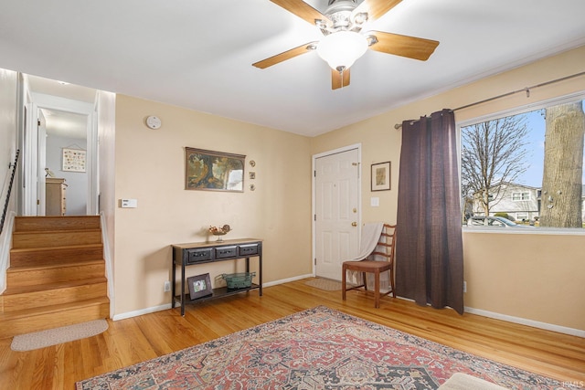 entrance foyer with ceiling fan and hardwood / wood-style flooring