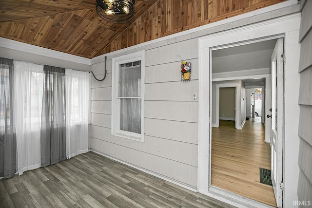 interior space featuring vaulted ceiling and wood ceiling