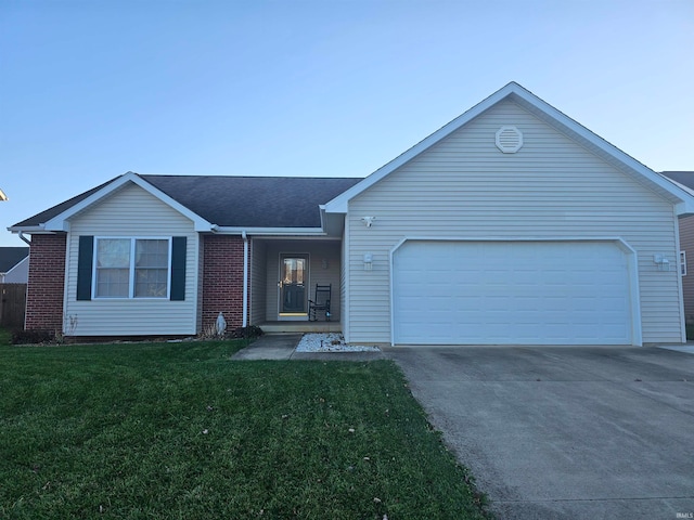 ranch-style house with a front lawn and a garage