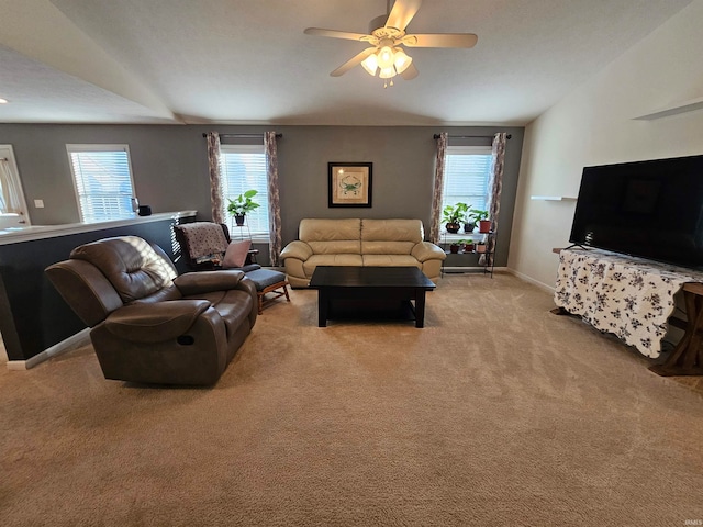 living room featuring ceiling fan and light colored carpet