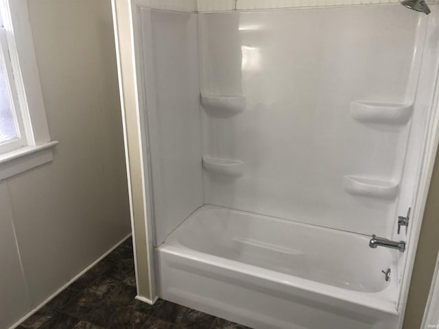 bathroom with washtub / shower combination