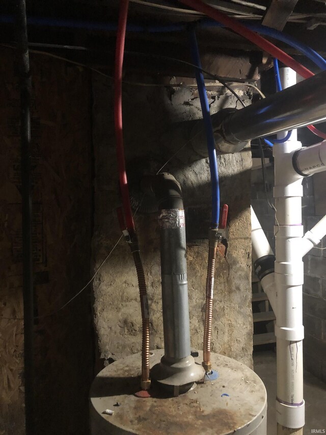 utility room featuring water heater