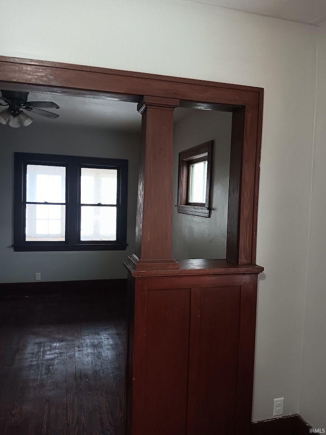 details with decorative columns, ceiling fan, and hardwood / wood-style flooring