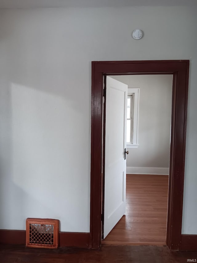 hallway featuring dark wood-type flooring