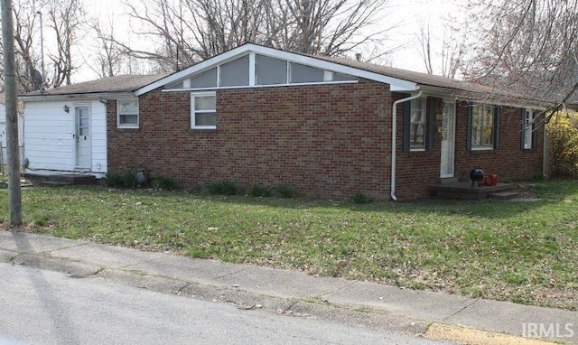 view of home's exterior with a yard