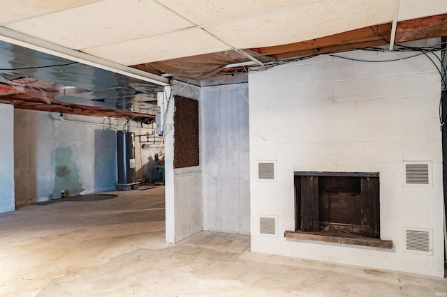 basement featuring electric water heater