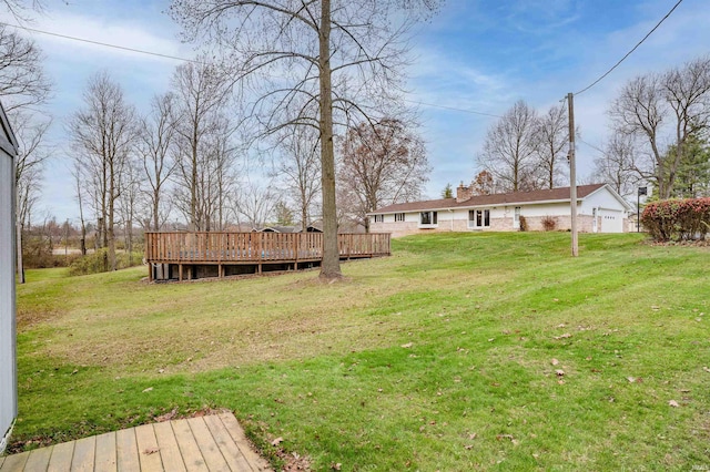 view of yard featuring a wooden deck