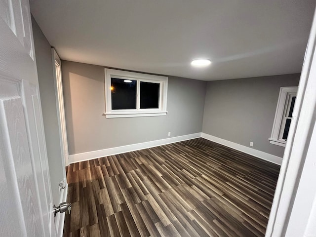 spare room featuring dark hardwood / wood-style floors