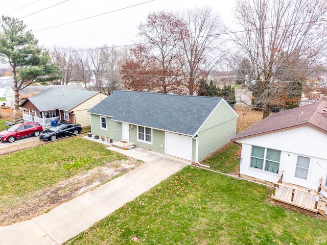 view of front of house featuring a garage and a front lawn