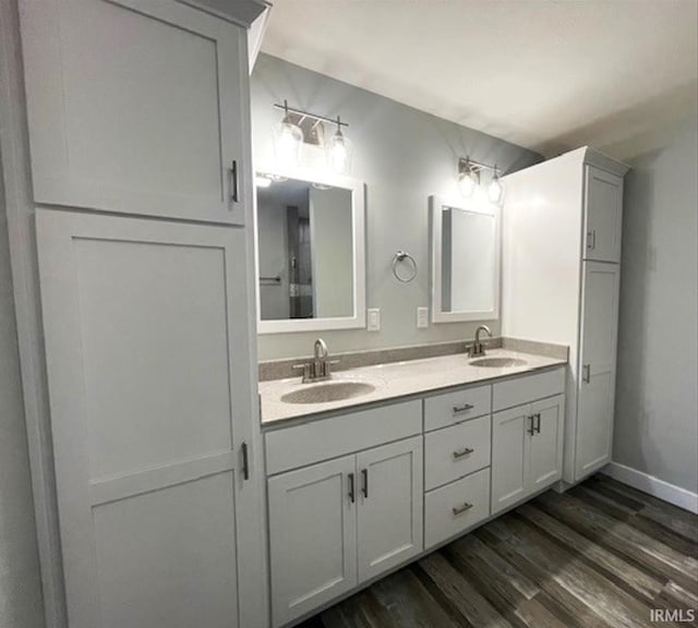 bathroom featuring vanity and wood-type flooring