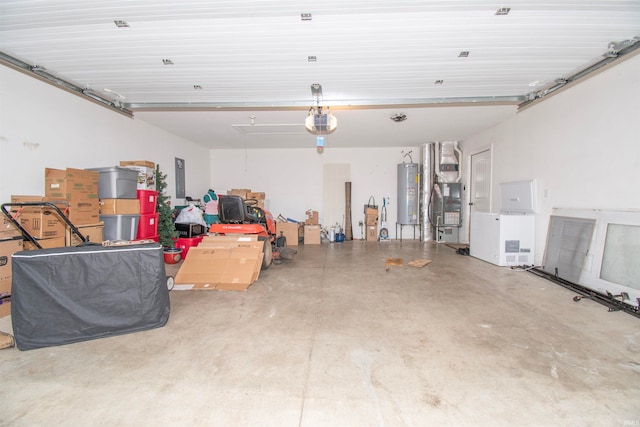 garage featuring a garage door opener, electric panel, and water heater