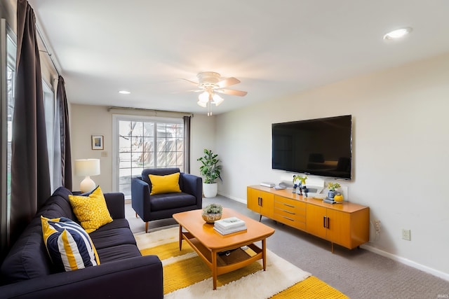 living room with ceiling fan and light carpet