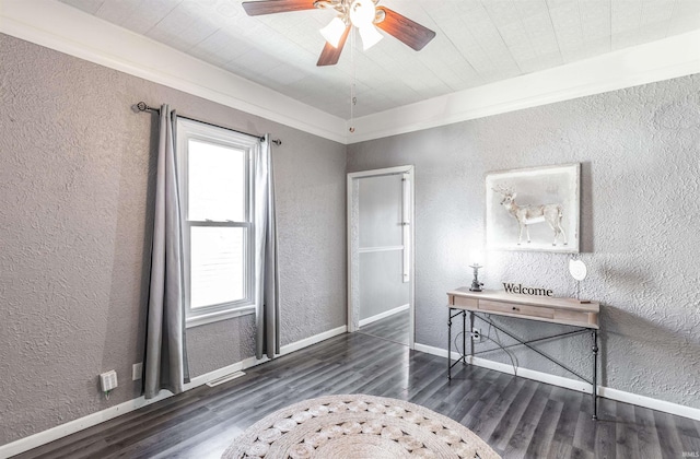 office area with dark hardwood / wood-style flooring, ceiling fan, and ornamental molding