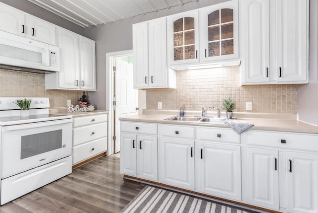 kitchen with dark hardwood / wood-style floors, white cabinetry, white appliances, and tasteful backsplash