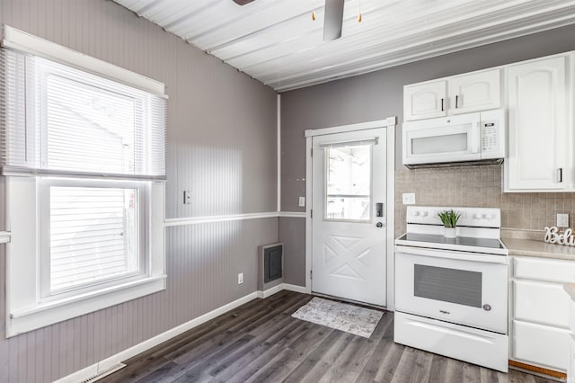 kitchen featuring white appliances, decorative backsplash, ceiling fan, dark hardwood / wood-style flooring, and white cabinetry