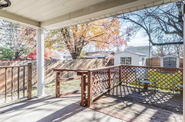 wooden terrace with a shed