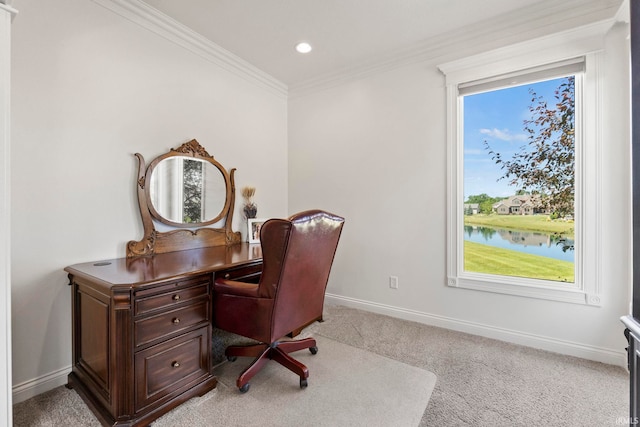 carpeted home office with a water view and crown molding