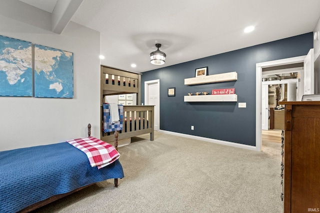 bedroom featuring ceiling fan and light colored carpet