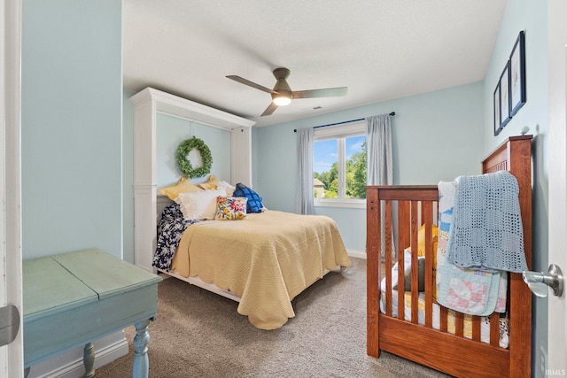 bedroom featuring ceiling fan and carpet floors