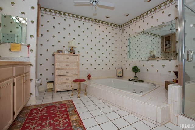 full bathroom featuring ceiling fan, tile patterned floors, separate shower and tub, toilet, and vanity