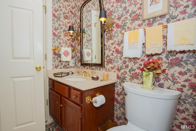 210 Shane Ct, Evansville, IN 47715 - half bath featuring wallpapered walls, vanity, and toilet