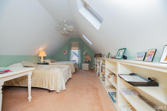 carpeted bedroom featuring ceiling fan and lofted ceiling with skylight