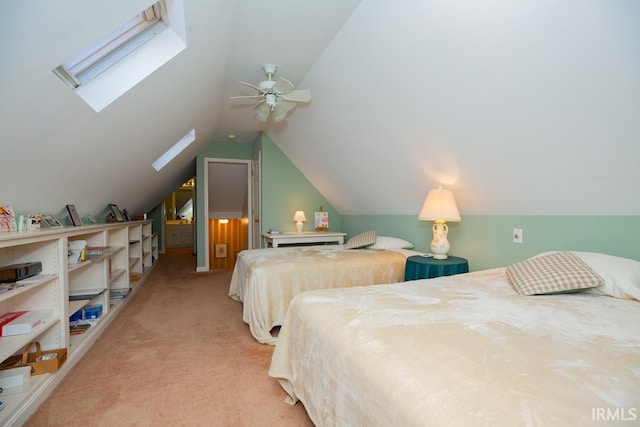 carpeted bedroom featuring ceiling fan and lofted ceiling with skylight