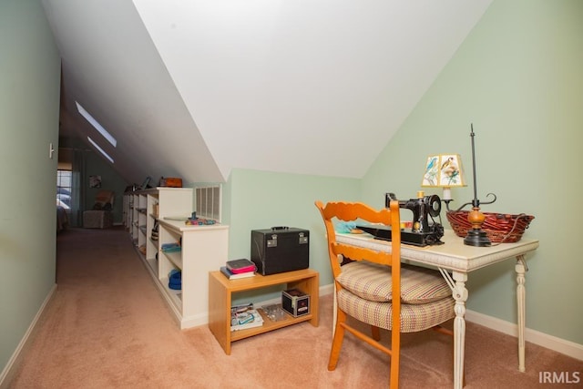 office space with light colored carpet and vaulted ceiling