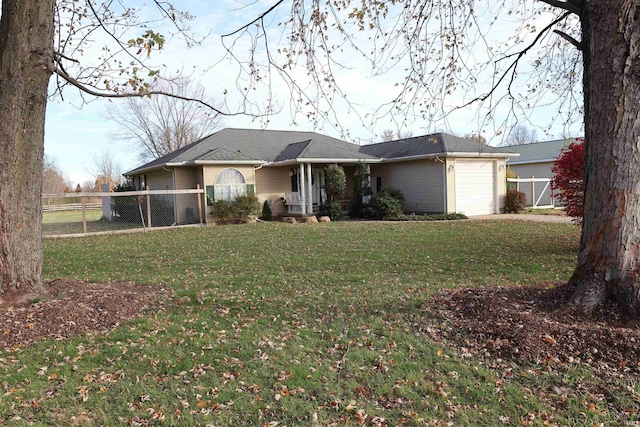 view of front of home with a front lawn and a garage