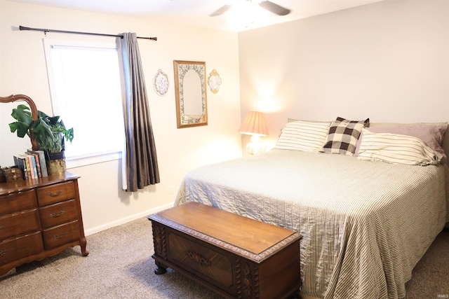 bedroom featuring light carpet, multiple windows, and ceiling fan