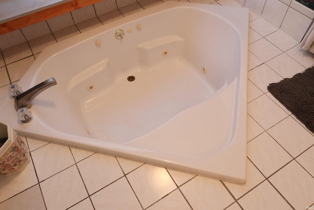 bathroom with tile patterned floors and a bathing tub