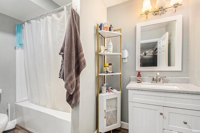 full bathroom with vanity, hardwood / wood-style flooring, toilet, and shower / bath combo with shower curtain