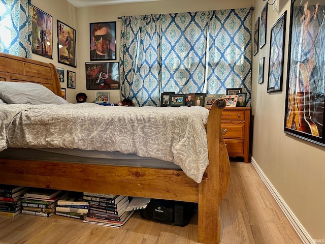 bedroom with wood-type flooring