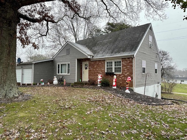 view of front of home with a garage and a front yard