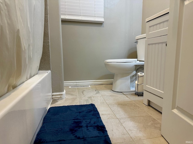 bathroom with radiator heating unit, shower / tub combo, and toilet