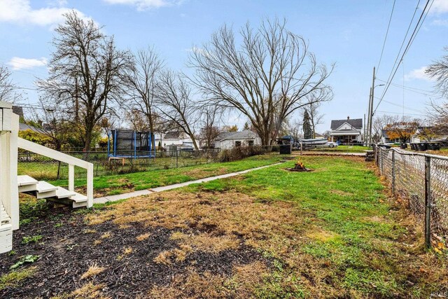 view of yard featuring a trampoline