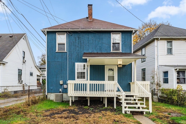 rear view of property with a porch