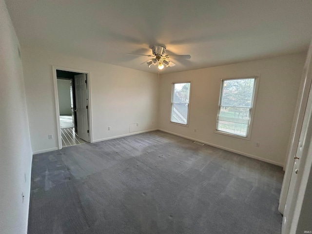 spare room with ceiling fan and carpet floors