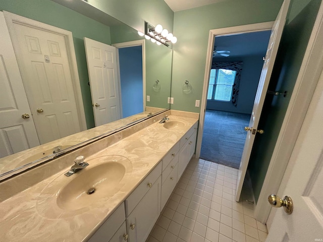 bathroom with tile patterned floors and vanity