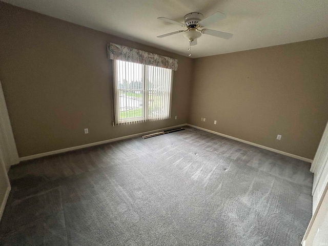 empty room with carpet and ceiling fan