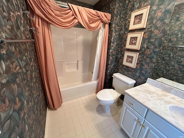 full bathroom with tile patterned floors, shower / bath combo, toilet, and vanity