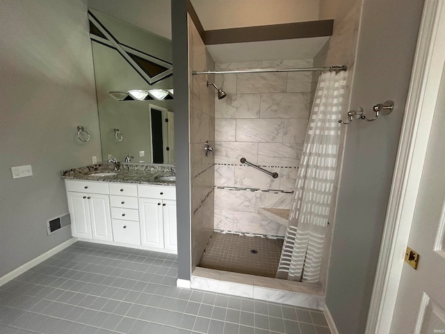 bathroom with tile patterned floors, vanity, and a shower with shower curtain