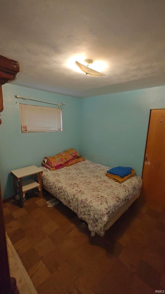 bedroom with a textured ceiling