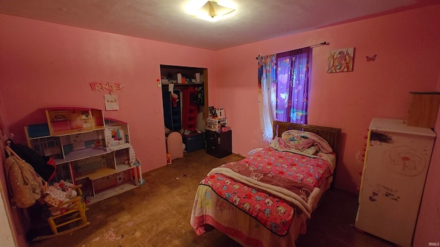 bedroom with hardwood / wood-style flooring