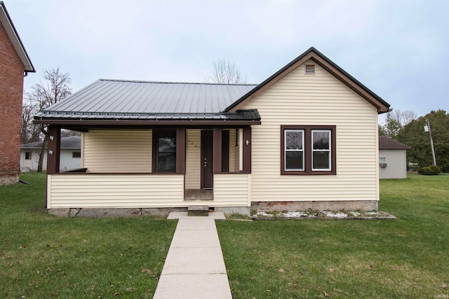 bungalow-style house featuring a front yard