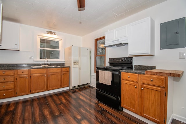 kitchen featuring sink, black electric range oven, white refrigerator with ice dispenser, ventilation hood, and electric panel