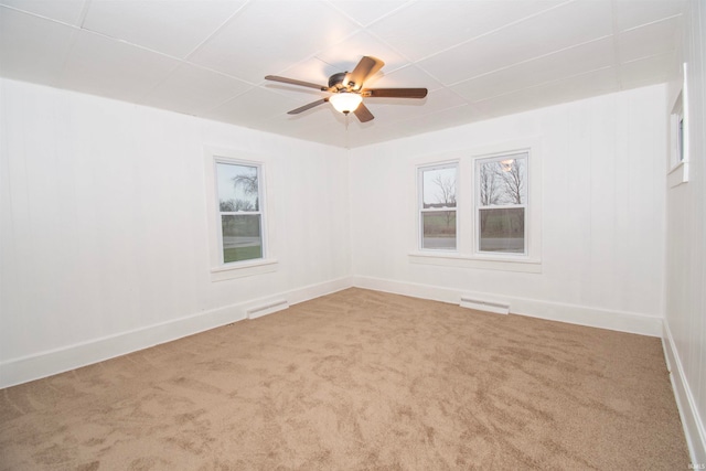 spare room featuring carpet floors and ceiling fan