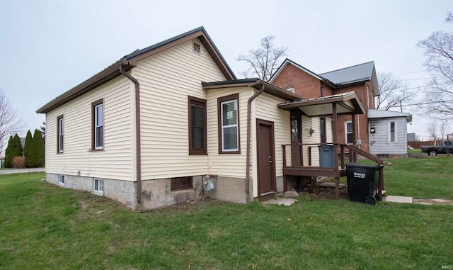 view of home's exterior with a lawn