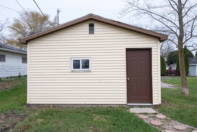 view of outdoor structure with a lawn